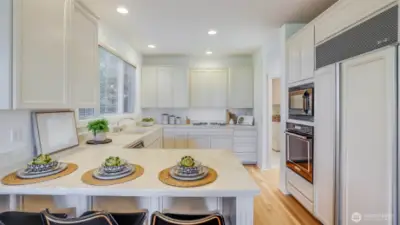 A generous gourmet kitchen with abundant cabinetry and a breakfast nook.