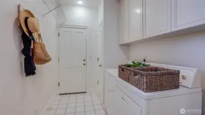 A laundry room conveniently located near the entry from the oversized two-car garage adds everyday ease.