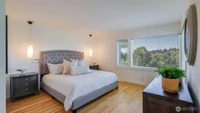Upstairs, the primary suite offers a private retreat.