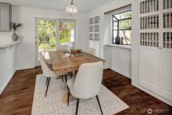 A breakfast nook with sliding doors leads seamlessly to the backyard oasis.