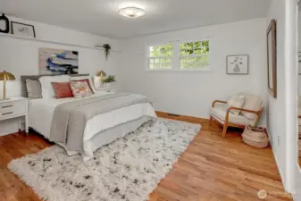 Primary bedroom with built-in ceiling shelves.