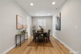 Elegant Dining Room – Bright and welcoming with wood-style floors and recessed lighting, this formal dining space is perfect for family dinners or entertaining guests.