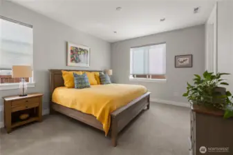 Spacious Primary Suite – Peaceful retreat with plush carpet, generous natural light, and ample room for a king bed and additional furnishings.