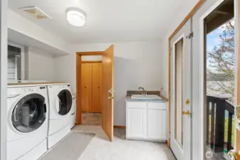 Laundry room/Mud room with french doors to side deck.