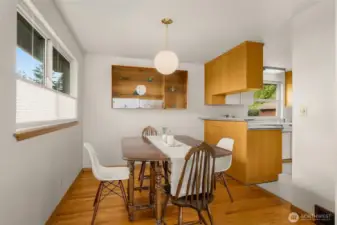 Dining area has custom showcase cabinet