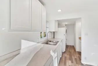 Washer/dryer in kitchen. Bump out back wall for 2nd bdrm