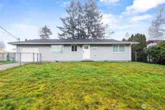 Step outside from the living room into the spacious backyard and enjoy the sun!