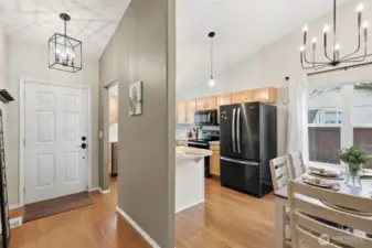 Entry way leads to kitchen and dining area