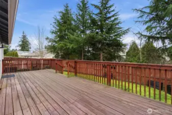Walk out the back door to your back deck and fully fenced yard