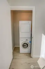 Laundry closet next to kitchen and dining room.