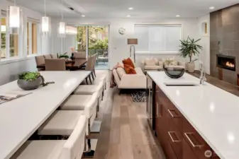 Chef's prep island with a sink and wine/beverage refrigerator, quartz countertops.