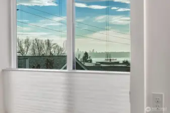 Peekaboo view of Lake Washington & Seattle.