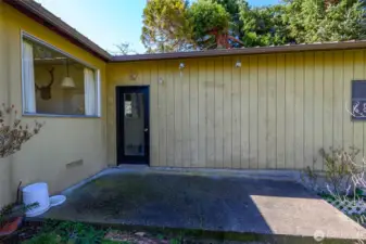 Patio with door into attached 3-car garage.
