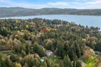 5 acres, two tax lots, surrounded by high end homes, potential lake views, flat building spots - a truly rare find.