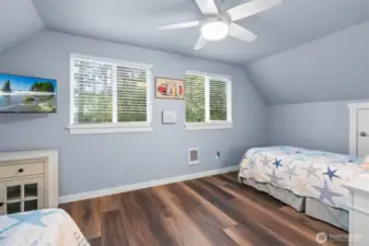 Spacious second bedroom on upper level with room enough for two beds.