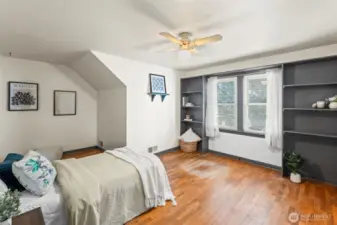 Second upstairs bedroom with built-ins and large closet.