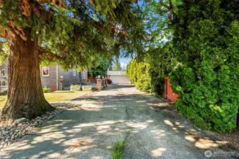 Long driveway leads to detached 2-car garage.
