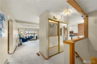 Entry way w/stairs to lower level on right and main floor living