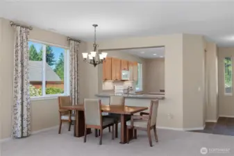 Dining that is open to the kitchen.