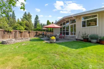 Garden beds for the green thumb, patio for summer BBQ's, and a perfect yard for pets and play.