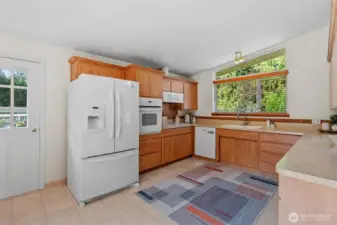 All appliances stay and check out the counterspace! Also has space for informal dining.