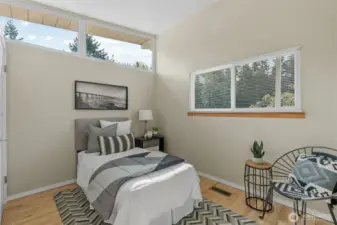 Main level bedroom is filled with natural light and is just steps from the updated main hall bath.