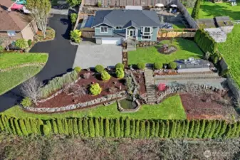 Newly poured extended driveway spanning from the street to the house.