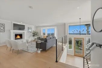 The sleek horizontal steel railings keep the staircase virtually open, making the entire space feel larger and more connected.