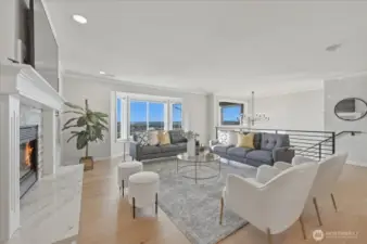 Beautiful artisan hickory floors flow throughout this stunning living room. The quartz hearth fireplace adds warmth and sophistication.