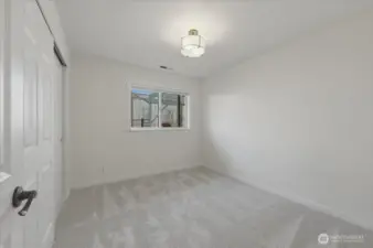 Additional upper-level bedroom with brand new carpet, cordless blackout blinds and updated closet doors and hardware for a clean, modern feel.