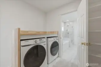 Laundry day just got easier with a full-size washer and dryer perfectly tucked into the primary suite closet.