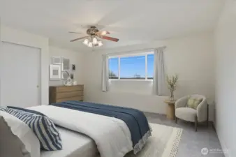Wake up to sweeping views in this expansive lower-level bedroom, complete with a large closet and picture window mirroring the upper-level vistas. Virtually staged for inspiration.