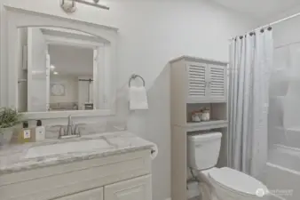 Full bathroom with quartz counters, making the lower level a truly independent living suite.