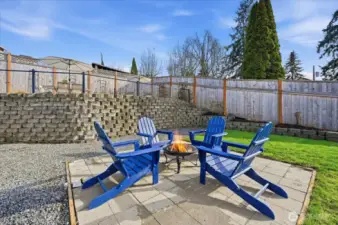 One of many gathering spots on the property! Backyard is fully fenced.