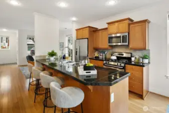 Moder finishes meet warm wood in a functional kitchen design.