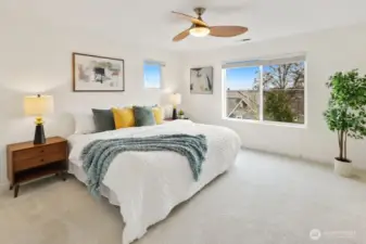 The spacious primary retreat. Wake up to views of Downtown Bellevue and the Cascades right from your window.