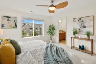 The spacious primary retreat faces East, welcoming the morning sun and offering an elegant en suite for a true spa-at-home feel.