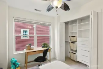 A versatile East-facing spare room featuring a custom California Closets design to keep everything perfectly organized.