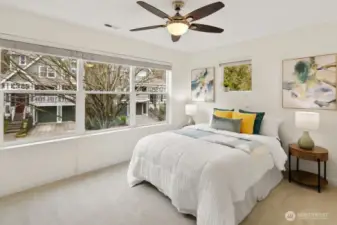 This spacious West-facing spare bedroom is flooded with afternoon light, making it an ideal second suite,with plenty of room to spread out.