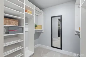 Primary walk-in closet with high quality closet system