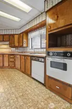 Spacious kitchen with plenty of counter and cabinet space and an eating bar opens to the family room.