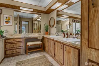 Master bedroom suite with a double walk in closet and 5 piece bathroom overlooks the lake.  Virtually staged photo