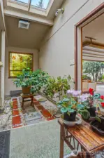 Atrium/greenhouse between the utility room and the garage