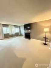 Spacious living room with fireplace and large screen TV included
