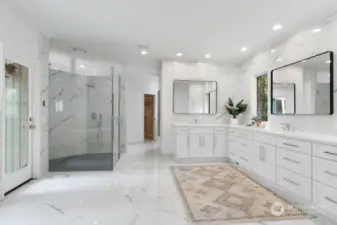 The enormous newly updated bathroom features heated designer tiled floor, free standing soaking tub, new vanity with quartz counters and 2 walk-in closets.