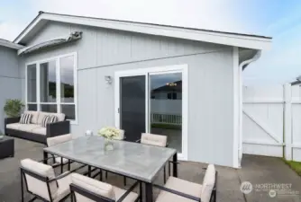 * Virtual Staged * A brand-new sliding door provides direct access to the primary suite from the patio, while a gate to the right leads to the front yard for added convenience.