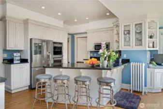 Remodeled Kitchen with custome white cabinets and black granite counters