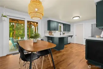 Large dining area with new flooring blends into the open kitchen