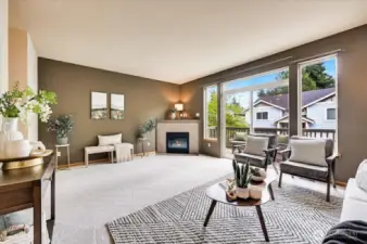 Large living room with Wall of Windows allowing for tons of natural light to flood the room!