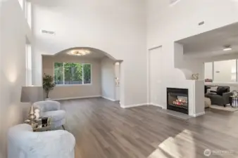 The spacious living area combined with expansive vaulted ceilings creates an attractive and inviting environment.